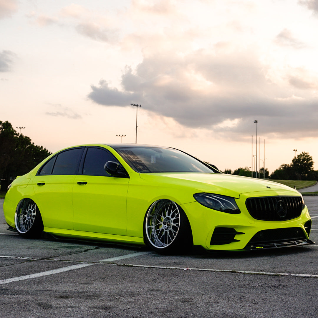 Vibrant Gloss Lime Green Vinyl Wrap on Front Shot of Mercedes E Class